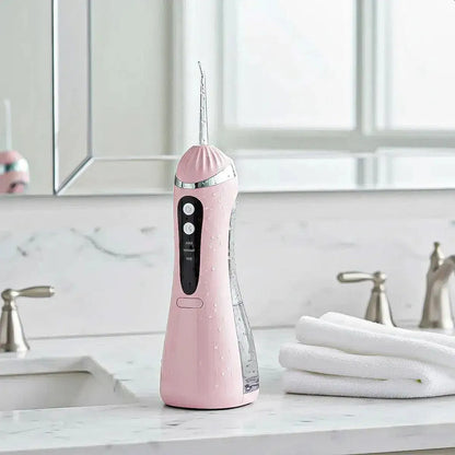 Irrigador Bucal Portátil Okshop Rosa Con 4 Boquillas Y 3 Presiones